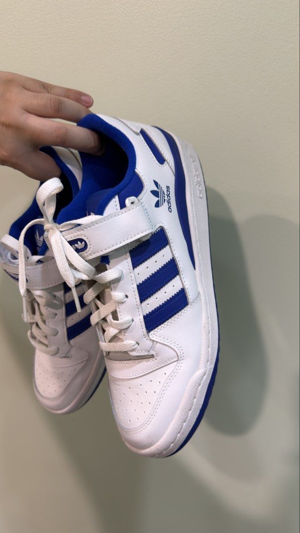 Adidas Forum Low White Blue Sneakers (Category: Casual Shoes) located in Manila. Submitted by MLim10 (Listing ID 1422682144, Image 3). Description: - Adidas Forum Low sneakers - White and blue colorway - Features the iconic three stripes - Velcro strap closure - Blue interior and soles - Adidas logo visible No box Only used once Delivery fee shouldered by buyer.