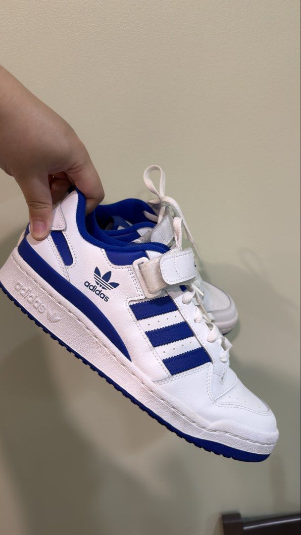 Adidas Forum Low White Blue Sneakers (Category: Casual Shoes) located in Manila. Submitted by MLim10 (Listing ID 1422682144, Image 2). Description: - Adidas Forum Low sneakers - White and blue colorway - Features the iconic three stripes - Velcro strap closure - Blue interior and soles - Adidas logo visible No box Only used once Delivery fee shouldered by buyer.