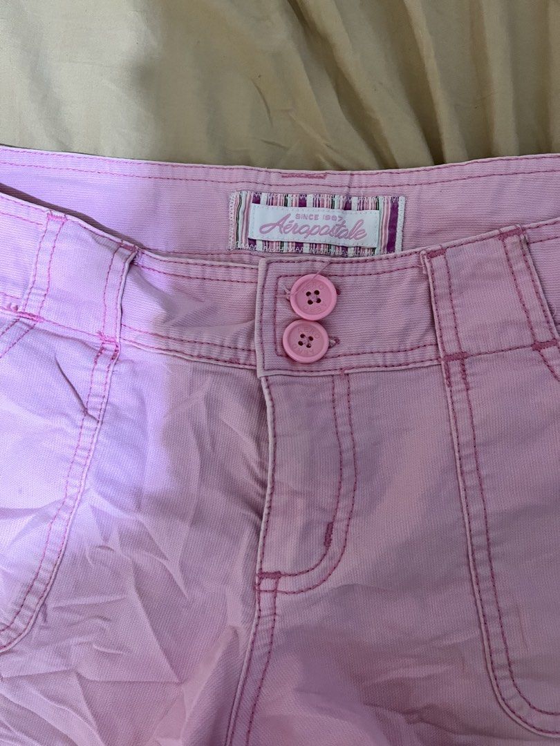 Aeropostale Pink Shorts 5/6 (Category: Shorts) located in San Mateo. Submitted by closetnitata (Listing ID 1422639403, Image 2). Description: - Aeropostale pink shorts - Size: 5/6 - Features: Two front pockets, two back pockets - Closure: Button and zipper - Material: 100% cotton - Details: Pink stitching - Perfect for casual wear.