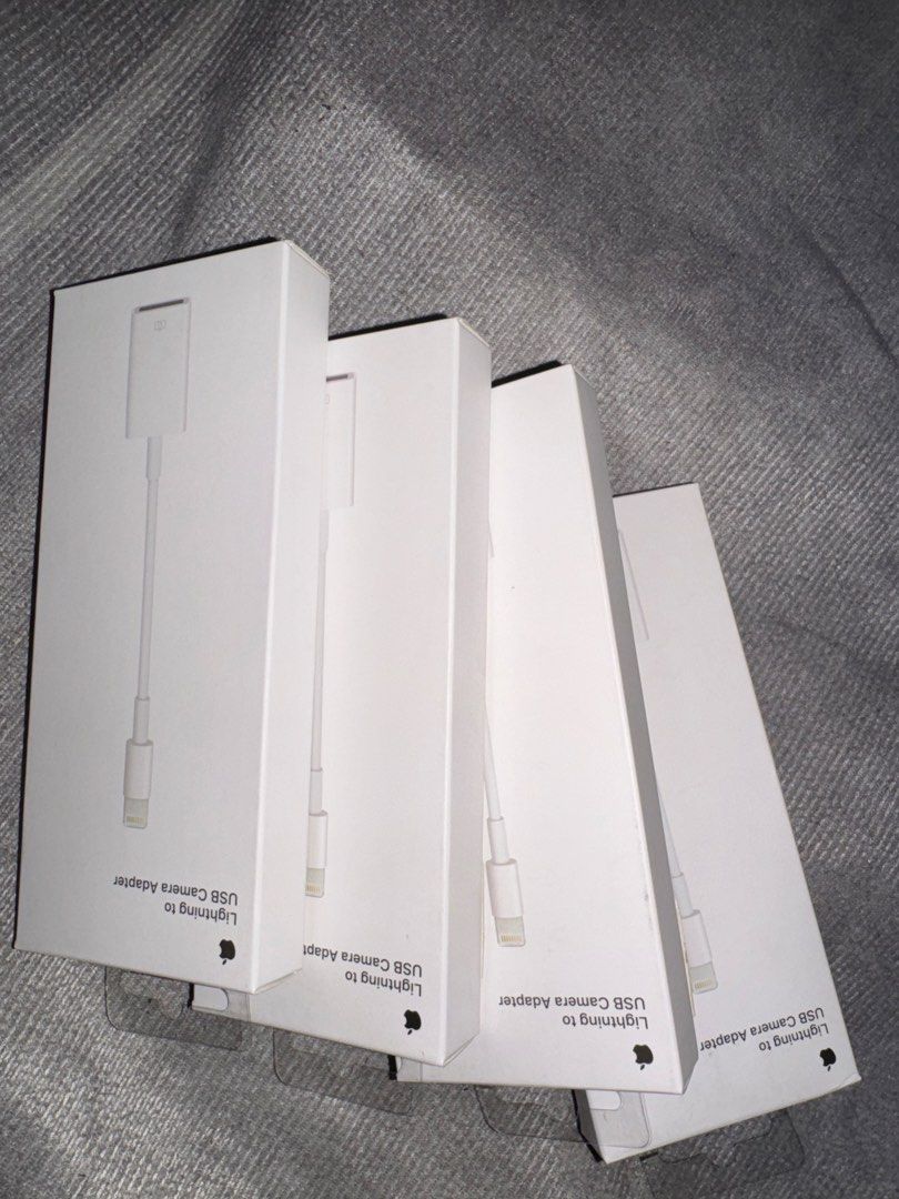 Apple Lightning to USB (Category: Chargers & Cables) located in Quezon City. Submitted by kentivan21 (Listing ID 1422569885, Image 1). Description: - Apple Lightning to USB Camera Adapter - Brand new and sealed - Allows you to connect your camera to your iPhone or iPad - Genuine Apple product - Perfect for transferring photos and videos Orig Price: 1790 400 each.