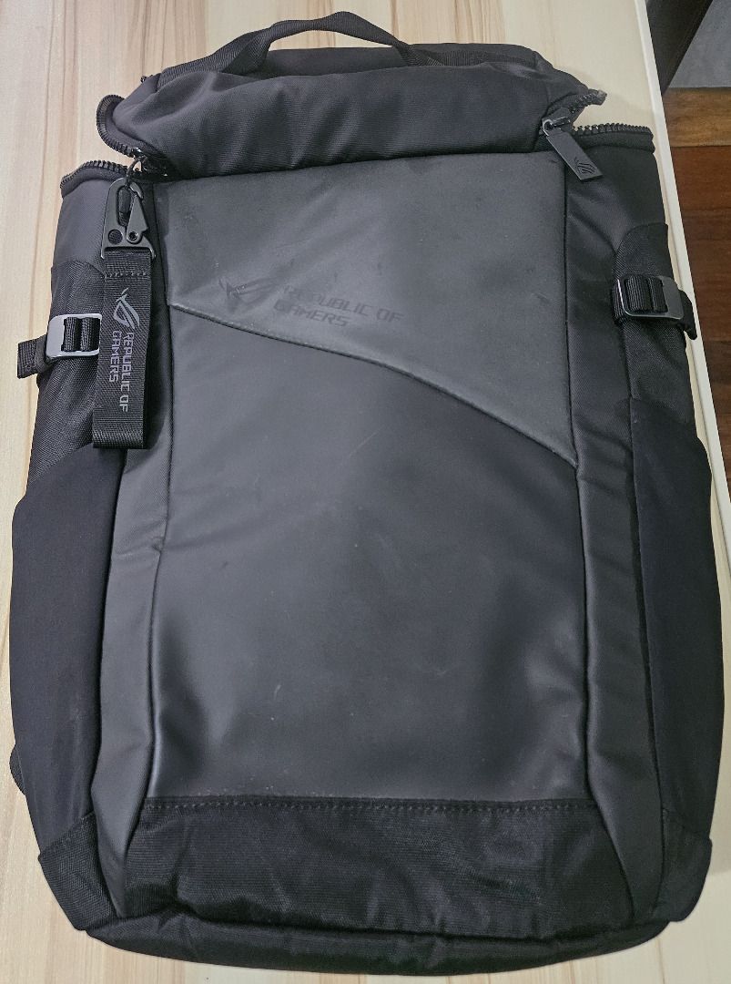 Asus ROG Ranger Backpack (Category: Laptop Bags & Sleeves) located in Makati City. Submitted by KuWeLaDevil01 (Listing ID 1422565892, Image 1). Description: Asus ROG Ranger Backpack (Black) We forgot (for almost three years) that we had this. Used once and kept. Some dirt marks but no scuff marks or damage to the zippers, the key chain or anywhere else. Outside material is water-repellent but do not go drenching this in the rain. The laptop compa