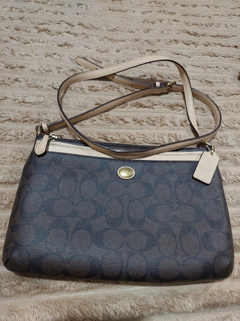 Authentic Coach swing pack (Category: Luxury Bags & Wallets) located in Manila. Submitted by zionzyrus (Listing ID 1422572370, Image 1). Description: no flaws,used only in an event by my sis from our package abroad.
