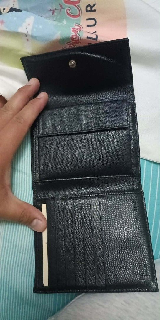 Authentic Prada M170 Tessuto (Category: Luxury Bags & Wallets) located in Quezon City. Submitted by armariodejara (Listing ID 1422682550, Image 2). Description: Decluttering Korea po nabili year 2005 The Prada M170 (or 1M0170) is a vintage-style, black (Nero) tri-fold wallet crafted from durable Prada Tessuto nylon with Saffiano leather trim. It features the iconic enameled metal triangle logo, a snap closure, multiple card slots, a bill compartm
