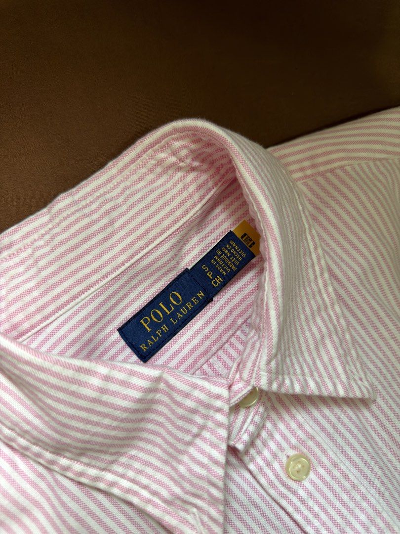 Authentic Ralph Lauren Oxford (w/QR) (Category: Longsleeves) located in Manila. Submitted by piagon (Listing ID 1422609712, Image 2). Description: Authentic RL Pink Stripes Oxford w/ QR for authenticity Small Classic fit Brandnew. Washed only but unworn. Bought this from a personal shopper in NY for 6k Rfs: I prefer XS size since this is classic fit MOP: BPI/Gcash MOD: Lalamove/Grab/GogoExpress/J&T c/o buyer. No COD. 📍España Manila near UST NO L