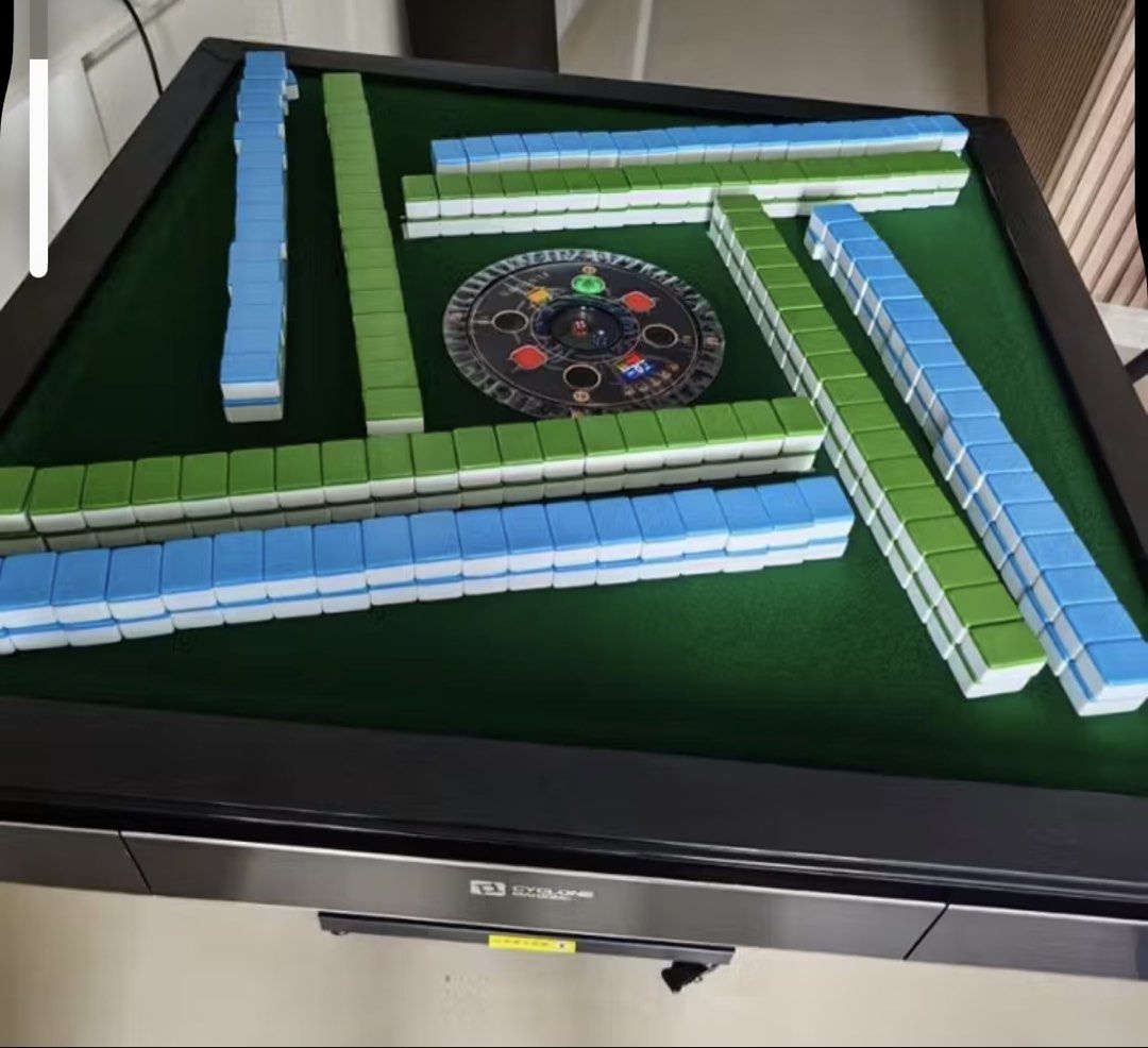 Automatic Mahjong Table (Category: Toys & Games) located in Singapore. Submitted by ahbroc (Listing ID 1422702970, Image 1). Description: - Automatic mahjong table - Includes tiles - Green playing surface - Black frame - Ready for mahjong! the stand of the table is slightly rusty. other than that all is good. we used it less than 10 times for the past 1 year . TAKE NOTE ! ! - need to self collect it from my my block . - need to arrange your own c