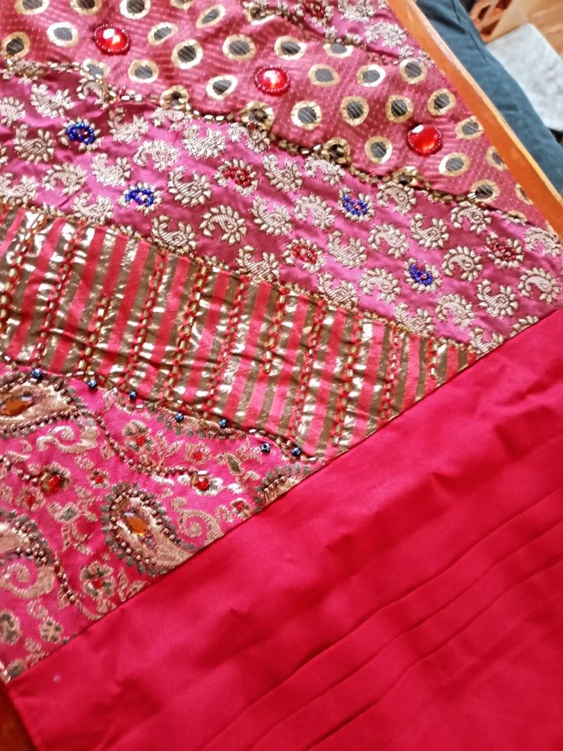Beaded Table Runner (Category: Table Linen & Textiles) located in Makati City. Submitted by meowmyella (Listing ID 1422556020, Image 1). Description: - Marina table runner, imported from India. - Exquisite embroidery and beadwork in red and gold. - Unique design with varied patterns and textures. - Dimensions: 33 x 182 cms. - Ideal for dining tables or consoles. - Adds an elegant touch to any space. ☹️missing one charm.