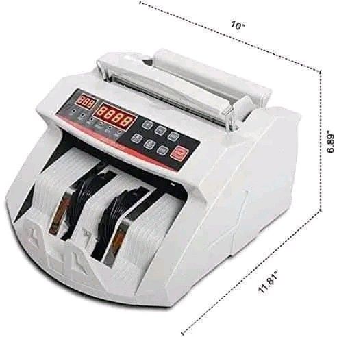 Bill Counter with LED Display (Category: Office & Business Technology) located in Makati City. Submitted by oideme (Listing ID 1422578447, Image 3). Description: Bill counter features an LED display and is designed for efficient currency counting. It has multiple buttons for various functions. The dimensions are approximately 11.81" x 10" x 6.89". The back of the device has a power switch and a port. It comes in its original packaging..