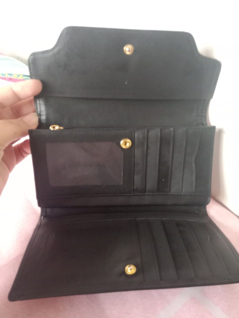 Black Patterned Wallet (Category: Wallets & Card holders) located in Bulacan. Submitted by chubbylicious (Listing ID 1422551754, Image 3). Description: - Black patterned exterior - Gold-colored clasp and hardware - Multiple card slots - Clear ID window - Zippered compartment - Leather or leather-like material.