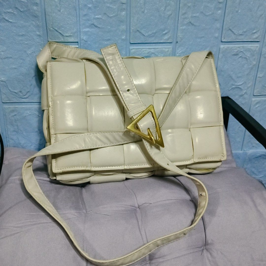 Bottega Veneta Padded Cassette Bag (Category: Luxury Bags & Wallets) located in Manila. Submitted by rose_onlineshop28 (Listing ID 1422682061, Image 1). Description: - Cream-colored Bottega Veneta Padded Cassette bag - Features woven design - Gold-tone buckle - Interior with zipper closure and Bottega Veneta logo - Includes shoulder strap - Made in Italy.