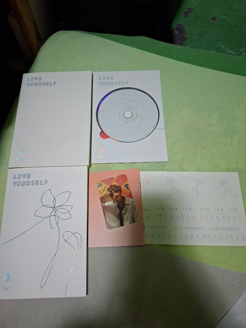 BTS Merch 💜 (Category: K-Wave Merchandise) located in Manila. Submitted by patriciajoeys0512 (Listing ID 1422687152, Image 2). Description: BTS Love Yourself HER Album unsealed but complete inclusion with BTS V photocard.
