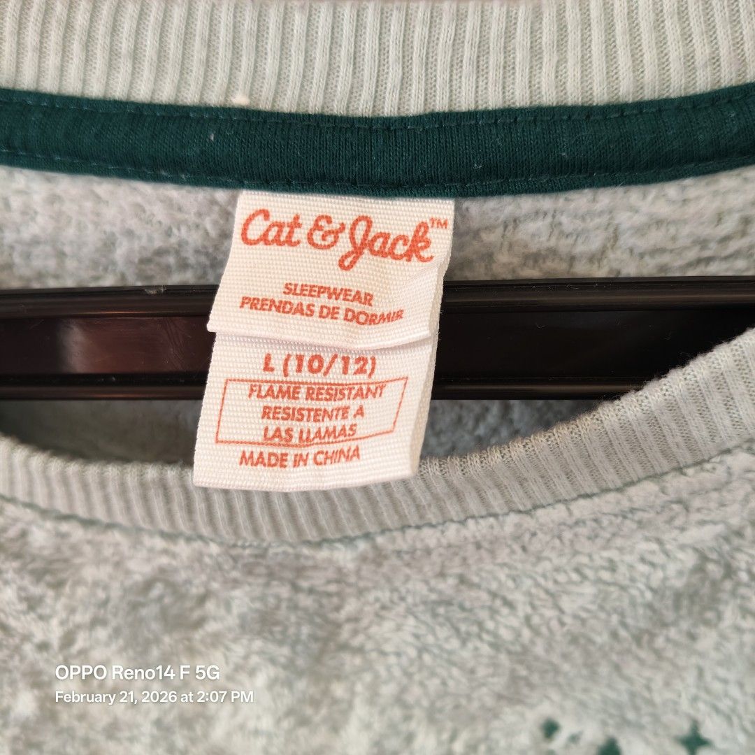Cat & Jack Sleepwear Sweatshirt - Size L (Category: Longsleeves) located in Santa Rosa. Submitted by secondglancemanila (Listing ID 1422593830, Image 2). Description: Cozy Cat & Jack sleepwear sweatshirt in a light blue color. Features a small embroidered Christmas tree design on the front. It has a round neckline with a dark green trim. The size is L (10/12). Fits 10y.o. kid.