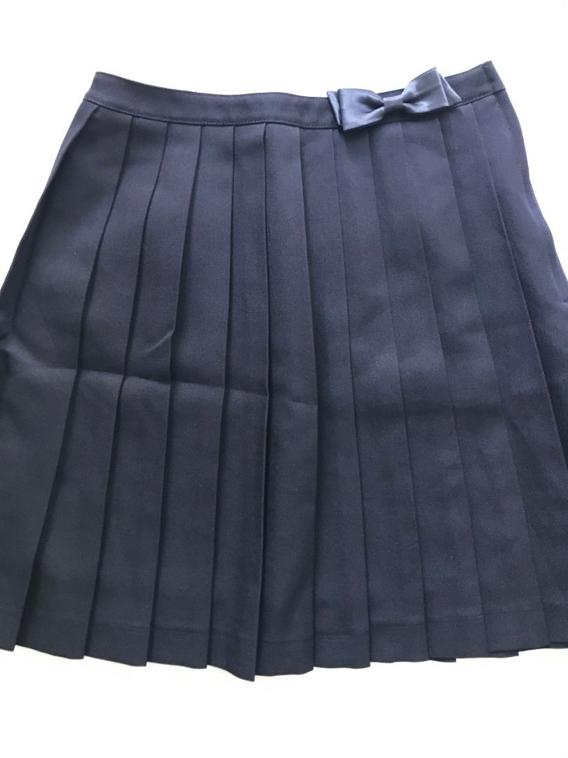 Chopin Deux Pleated Skirt with Bow (Category: Skirts) located in Bulacan. Submitted by roomarchive (Listing ID 1422700598, Image 2). Description: - Chopin Deux pleated skirt - Features a bow detail - Zipper closure - Dark fabric - Waist: 24in - Length: 17in - Classic design, versatile for various occasions.