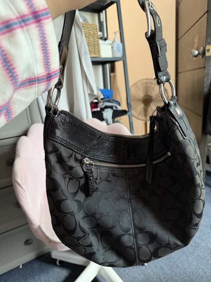 Coach Black Shoulder Bag (Category: Luxury Bags & Wallets) located in Manila. Submitted by k.123478 (Listing ID 1422705875, Image 3). Description: Vintage Coach Signature C - Black Coach shoulder bag - Signature pattern - Curved design - Leather trim and strap - Zipper closure - Silver-tone hardware - Minor wear on leather PRICE IS NEGO.