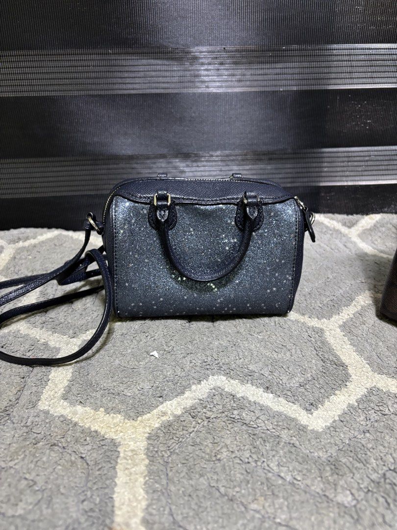 Coach Glitter Mini Satchel Crossbody Bag (Category: Luxury Bags & Wallets) located in Pasay City. Submitted by irishl (Listing ID 1422567574, Image 2). Description: - Coach mini satchel with a glittery finish - Includes a crossbody strap and dual top handles - Secure top zipper closure - Interior in a solid color - Adorned with gold-toned hardware - Comes with a small Coach tag - Ideal size for carrying essentials.