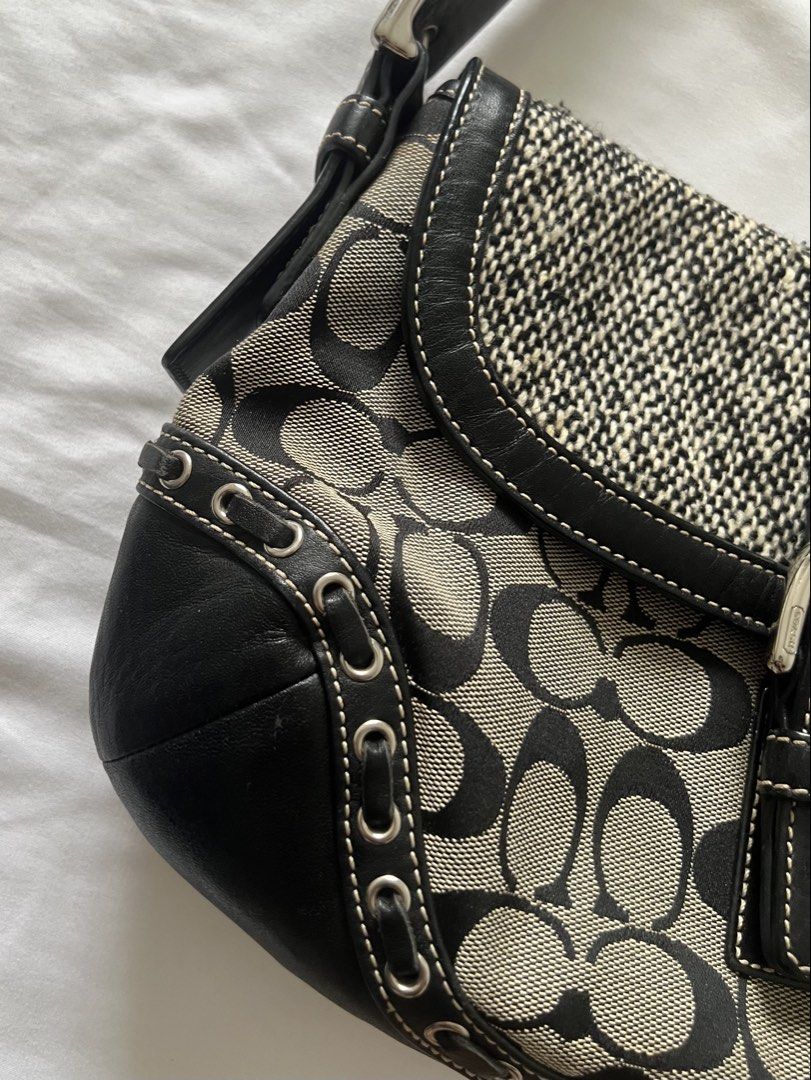 Coach Soho Black Canvas Monogram Leather Shoulder Bag (Category: Luxury Bags & Wallets) located in Quezon City. Submitted by declutterwjjj (Listing ID 1422575847, Image 3). Description: A vintage staple. Signature soho bag in canvas and leather. In Excellent Condition -minimal sign of use -unnoticeable hairline in hardware -leather still looks new Details 1 Zipper Pocket, 2 open pockets Hardware: Silver Tone Code: G06W-F10425 Zip: укк Approximate