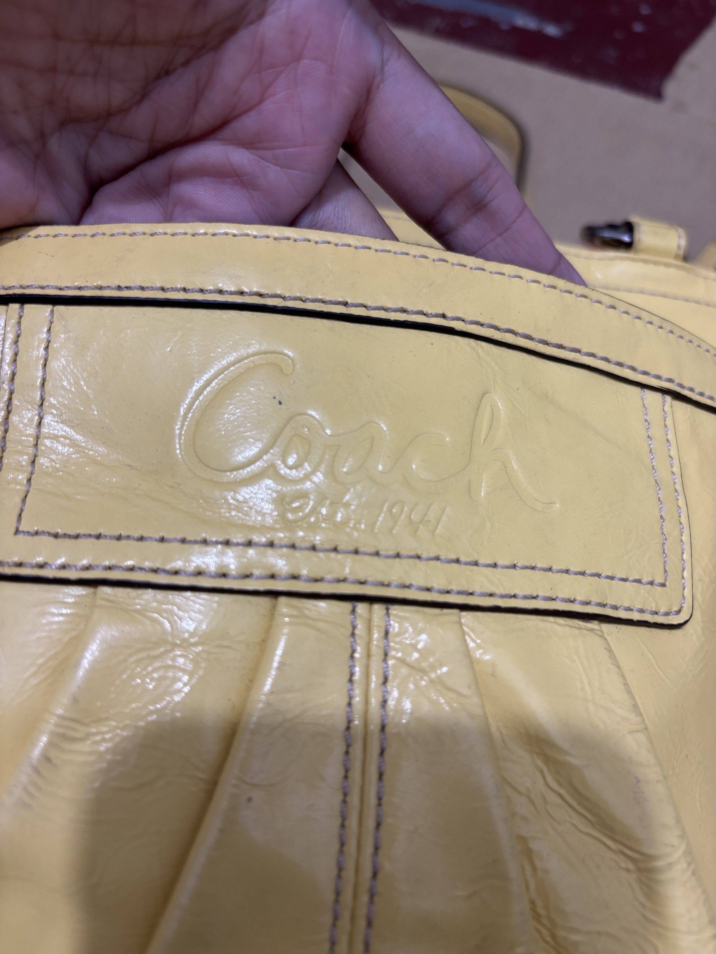 Coach Yellow Leather Tote Bag (Category: Shoulder Bags) located in Taguig. Submitted by macxdinglas (Listing ID 1422566290, Image 2). Description: - Yellow Coach tote bag - Main compartment with zipper closure - Interior pocket - Two exterior side pockets - Embossed Coach logo - Double handles - Silver-tone hardware - Authentic Coach Naka ykk mga zipper Padala ng sister ko from US malinis loob walang sira.