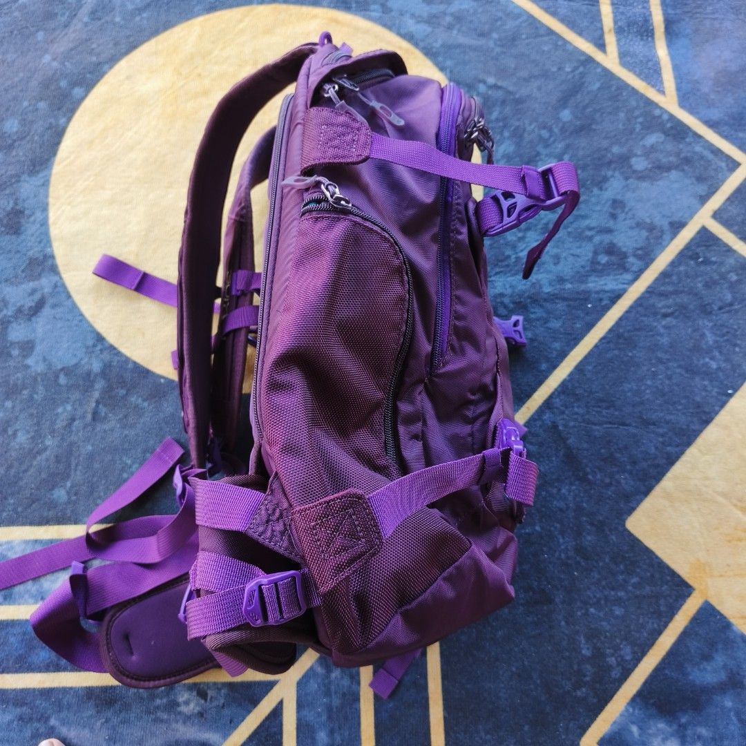 Dakine Urban Pro II Backpack - Purple (Category: Backpacks) located in Bayombong. Submitted by easyflip_04 (Listing ID 1422642119, Image 3). Description: - Dakine Urban Pro II backpack - Vibrant purple color - Multiple compartments for organization - Adjustable straps for a comfortable fit - Side pockets for easy access - Dakine logo on front and back - Secure storage with buckles and zippers.