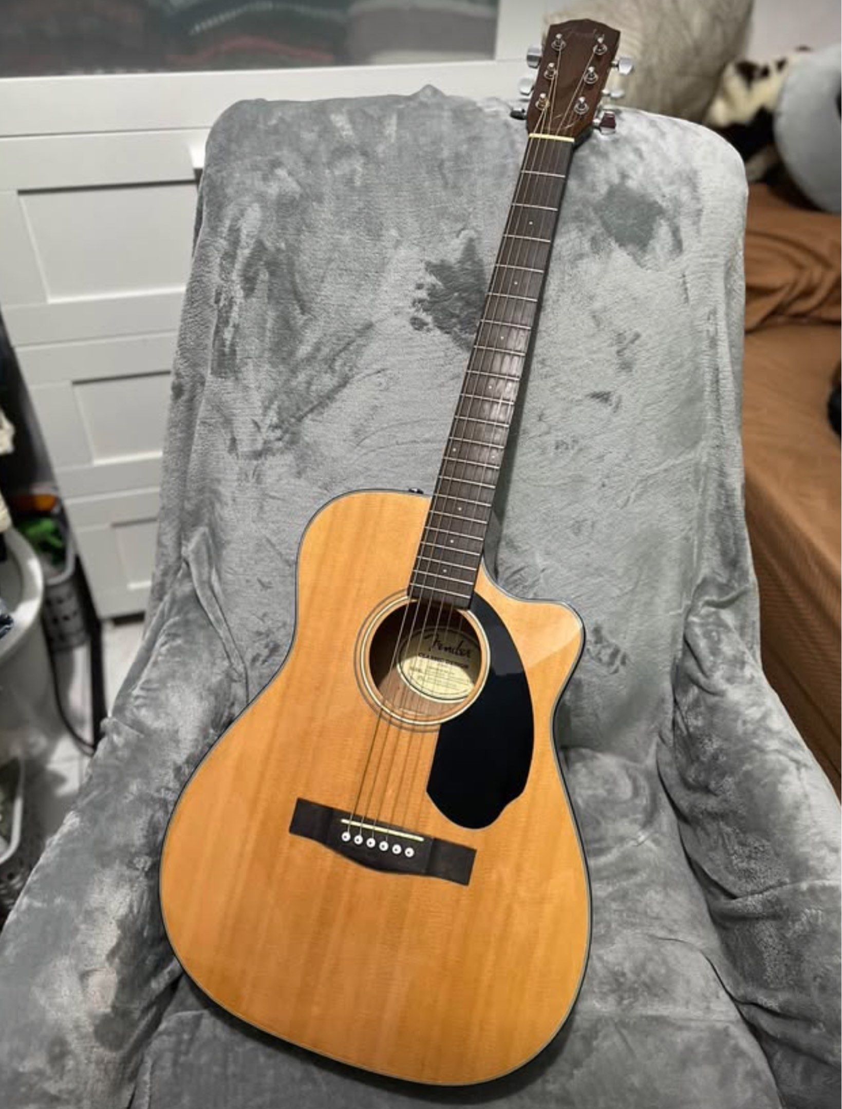 Fender Acoustic Guitar (Category: Musical Instruments) located in Davao. Submitted by justin_sells (Listing ID 1422695069, Image 1). Description: Fender Acoustic Guitar -rarely used, in excellent condition -Done full setup, low action, ready to play na -selling low - Natural wood finish - Fender headstock - Black pickguard - Cutaway design - Six strings - Bridge with white pins.