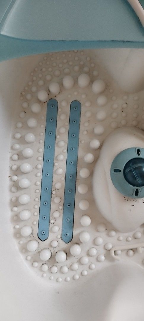 Foot Spa Massager (Category: Massage Devices) located in Makati City. Submitted by larasdowry (Listing ID 1422664040, Image 2). Description: Foot spa massager features a blue and white design. It has a dial for adjusting settings and a textured interior for massage. The unit includes a power cord..