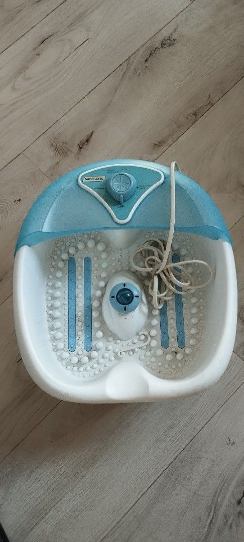 Foot Spa Massager (Category: Massage Devices) located in Makati City. Submitted by larasdowry (Listing ID 1422664040, Image 1). Description: Foot spa massager features a blue and white design. It has a dial for adjusting settings and a textured interior for massage. The unit includes a power cord..