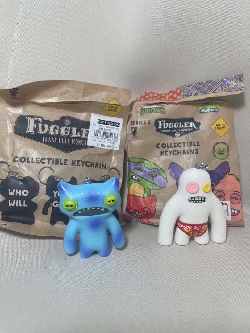 Fuggler series 1 and 2 keychain (Category: Designer & Blind Box Toys) located in Makati City. Submitted by bc_preloved (Listing ID 1422611220, Image 1). Description: 200 each Comes with original packaging. Kept in packaging after opening Series 1: Wide eyed weirdo blue Series 2: Catch me - sasquoosh white Mop: gcash Mod: sdd (buyer will book), j&t.