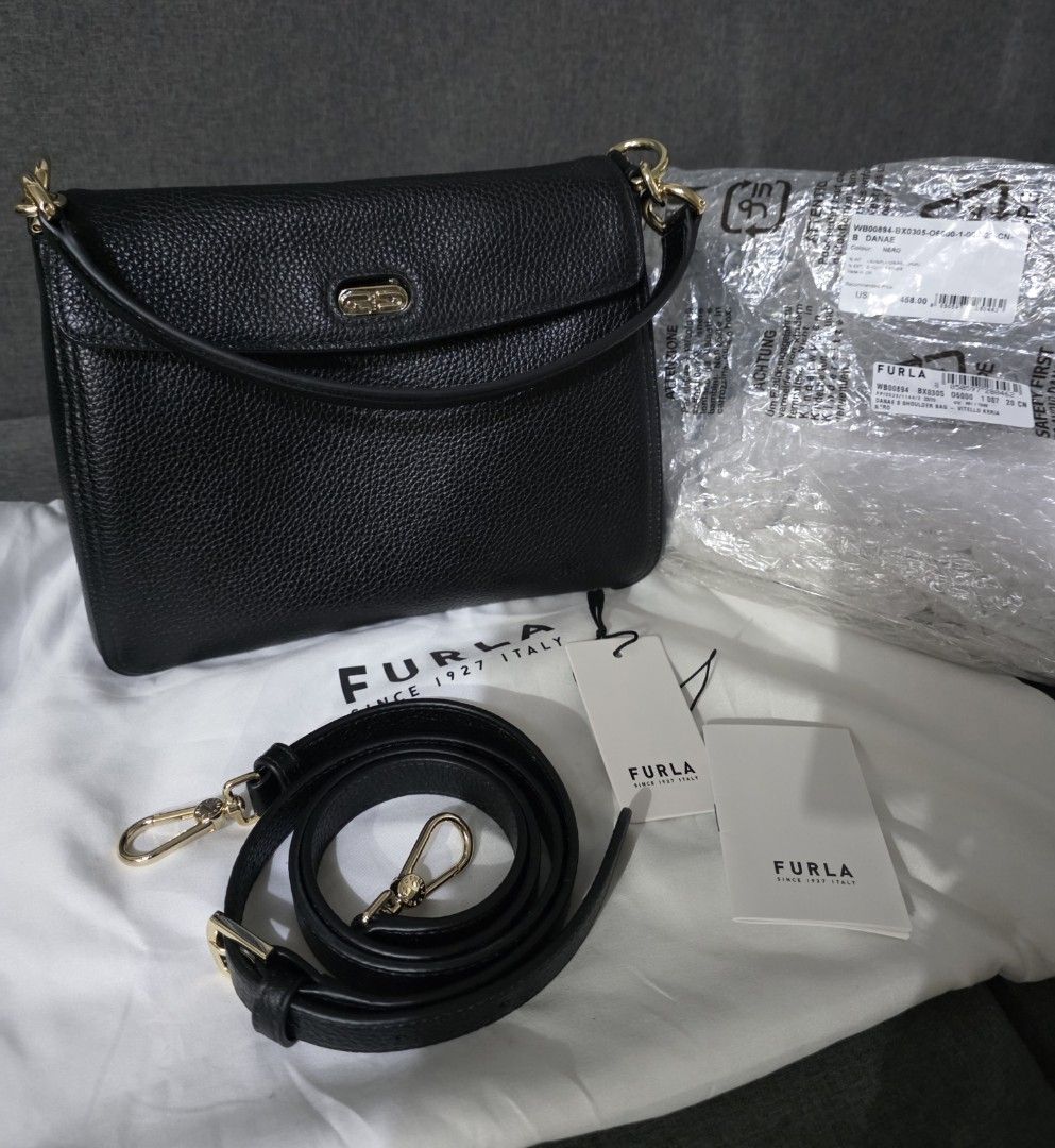 Furla Danae Bag - 2 Way Bag (Category: Luxury Bags & Wallets) located in Caloocan City. Submitted by authentictin (Listing ID 1422692173, Image 1). Description: Good as New! 9.8/10 Authentic Furla Danae 2 Way Bag - Color: Black - Features: - Detachable shoulder strap - Gold-tone hardware - Includes original tag, care card and dust bag - Very spacious inside - Original Price: $458 USD.
