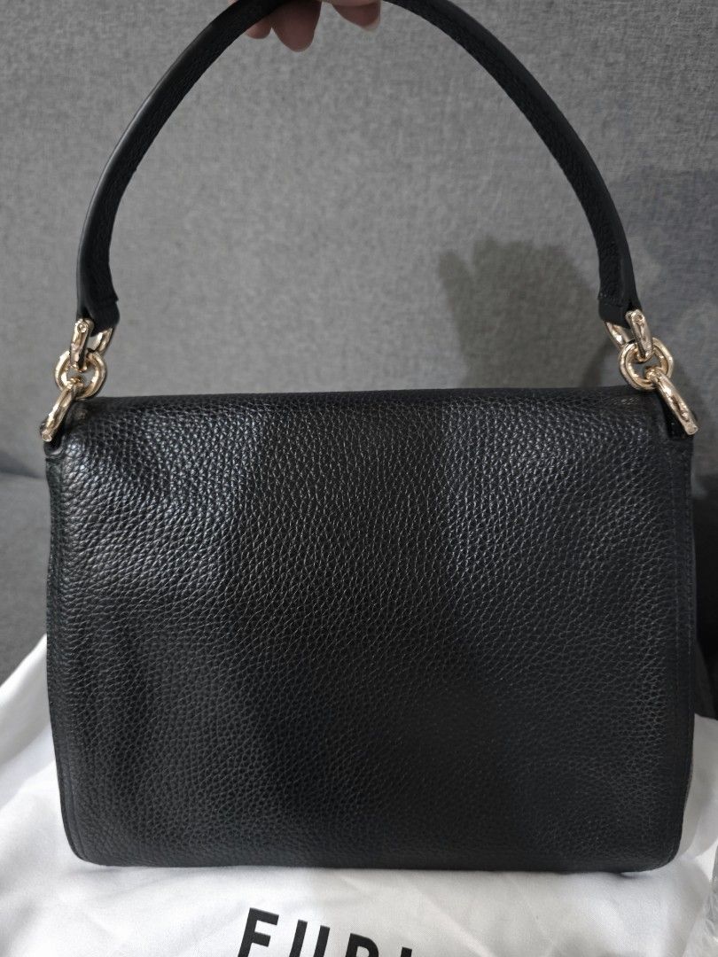 Furla Danae Bag - 2 Way Bag (Category: Luxury Bags & Wallets) located in Caloocan City. Submitted by authentictin (Listing ID 1422692173, Image 3). Description: Good as New! 9.8/10 Authentic Furla Danae 2 Way Bag - Color: Black - Features: - Detachable shoulder strap - Gold-tone hardware - Includes original tag, care card and dust bag - Very spacious inside - Original Price: $458 USD.