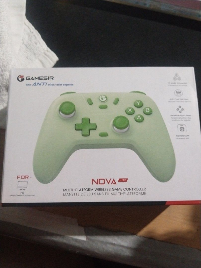 GameSir Nova Lite Multi-Platform Wireless Controller (Category: Controllers) located in Mandaluyong City. Submitted by eyji569 (Listing ID 1422701678, Image 2). Description: - GameSir Nova Lite wireless controller - Stylish green and white color scheme - Eye-catching green accents on buttons and joysticks - Comes with a protective carrying case - Designed for PC and other platforms - Equipped with anti-drift sticks for precise control.