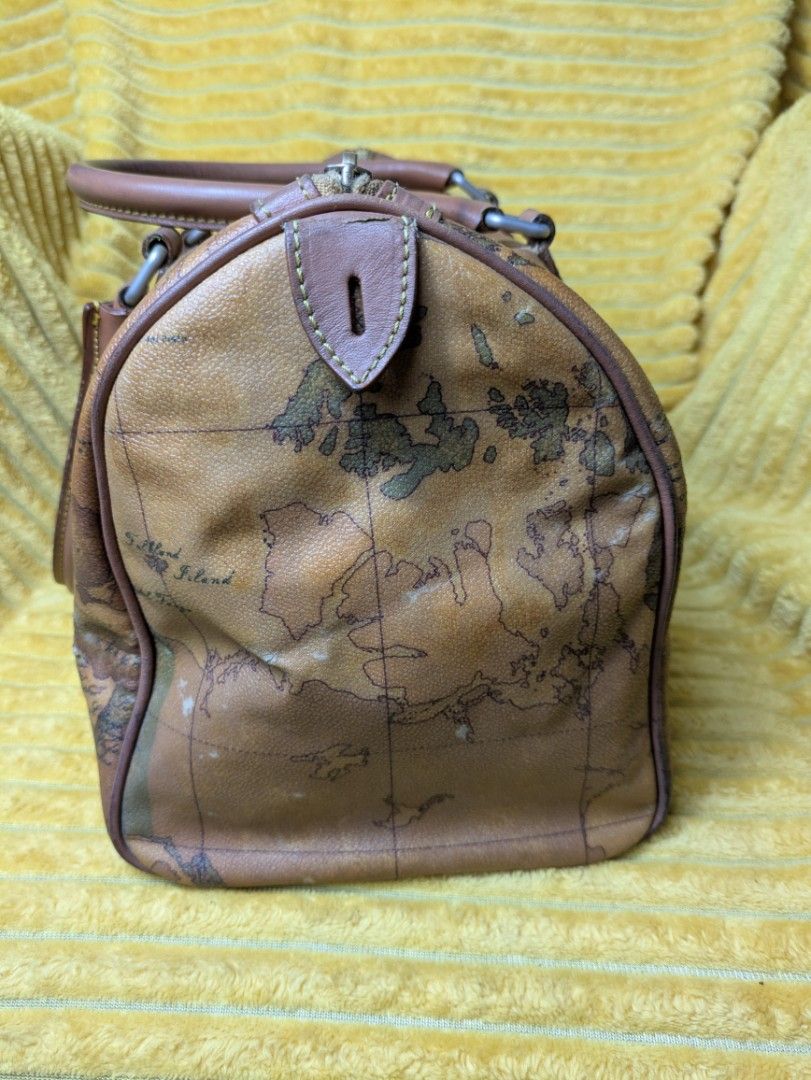 Geo Map Doctors Bag Large (Category: Luxury Bags & Wallets) located in Manila. Submitted by sakuraluxxefinds03 (Listing ID 1422627890, Image 3). Description: - Authentic Prima Classe handbag - Distinctive geo map design - Dual top handles - Secure zip closure - Includes a detachable tag - Interior: main compartment and zippered pocket - Exterior: World map design - Dark brown handles and trim.