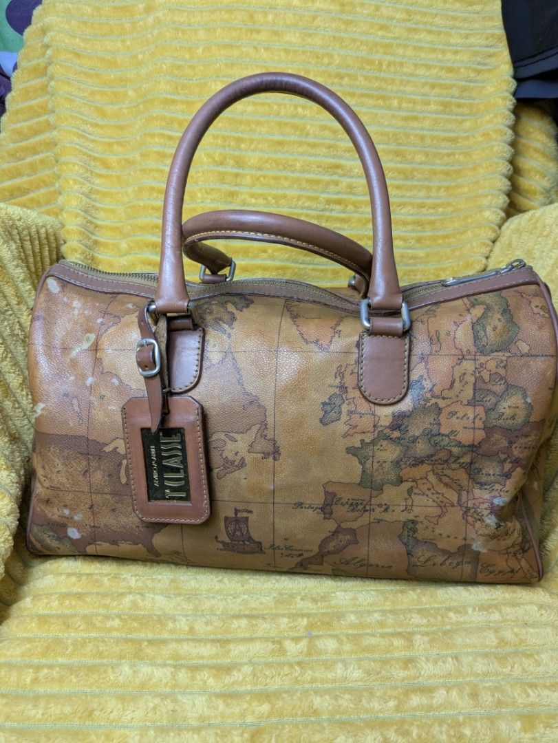 Geo Map Doctors Bag Large (Category: Luxury Bags & Wallets) located in Manila. Submitted by sakuraluxxefinds03 (Listing ID 1422627890, Image 1). Description: - Authentic Prima Classe handbag - Distinctive geo map design - Dual top handles - Secure zip closure - Includes a detachable tag - Interior: main compartment and zippered pocket - Exterior: World map design - Dark brown handles and trim.
