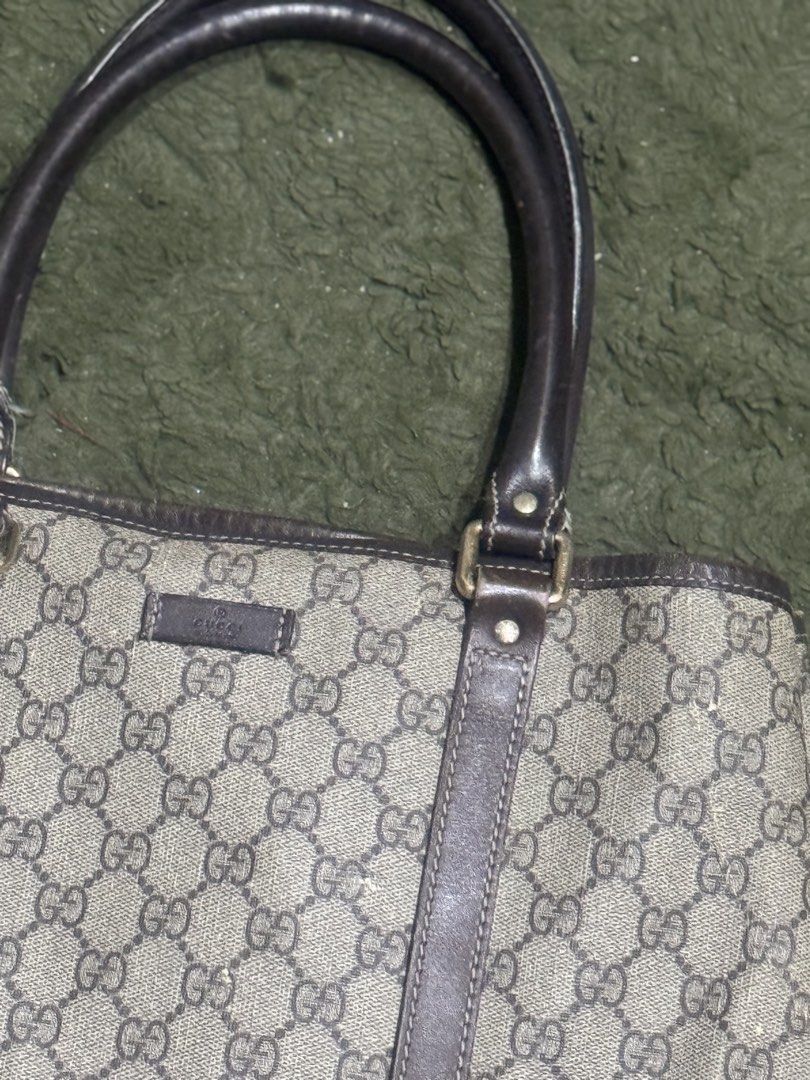 Gucci GG Supreme Tote Bag (Category: Luxury Bags & Wallets) located in Quezon City. Submitted by roxeyfoxey (Listing ID 1422576782, Image 2). Description: - Authentic Gucci tote bag - Iconic GG Supreme canvas - Brown leather handles and trim - Light-colored fabric interior - Signs of wear: marks on exterior, wear on handles - 7/10 arte rating.