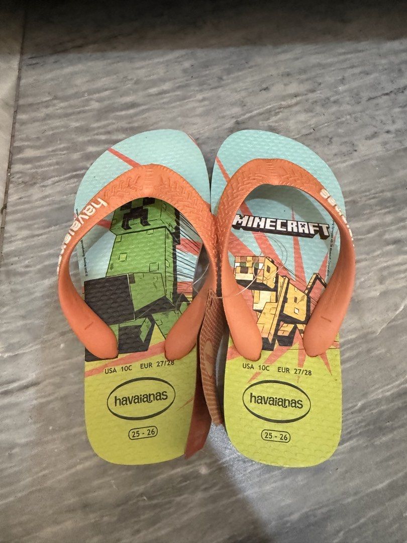 Havaianas Baby Flip-flops (Category: Babies & Kids Fashion) located in Bay. Submitted by Mrs.B (Listing ID 1422637832, Image 2). Description: - Havaianas baby flip-flops, size 25-26 - Available in two styles: - Yellow with green straps and Brazilian flag design, unused w/o tag - 400 - Minecraft-themed with orange straps, green and blue color scheme, unused with tag - 600.