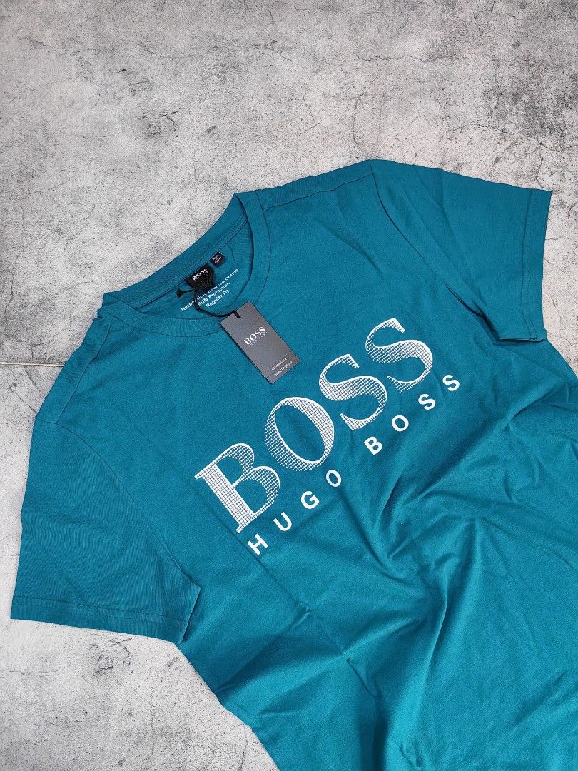 Hugo Boss BOSS T-shirt (Category: Tshirts & Polo Shirts ) located in Quezon City. Submitted by 110collectionsph (Listing ID 1422631329, Image 1). Description: PAMIGAY PRESYO NEW DROP ‼️ STEAL PRICE B0SS REGULAR FIT T-SHIRT | SMALL ONLY | P2,888 - Brand: Hugo Boss - Color: Teal - Design: BOSS logo print on front - Neckline: Crew neck - Sleeves: Short sleeves - Fit: Regular fit - Condition: New with original tags.
