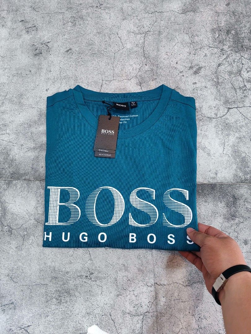 Hugo Boss BOSS T-shirt (Category: Tshirts & Polo Shirts ) located in Quezon City. Submitted by 110collectionsph (Listing ID 1422631329, Image 3). Description: PAMIGAY PRESYO NEW DROP ‼️ STEAL PRICE B0SS REGULAR FIT T-SHIRT | SMALL ONLY | P2,888 - Brand: Hugo Boss - Color: Teal - Design: BOSS logo print on front - Neckline: Crew neck - Sleeves: Short sleeves - Fit: Regular fit - Condition: New with original tags.
