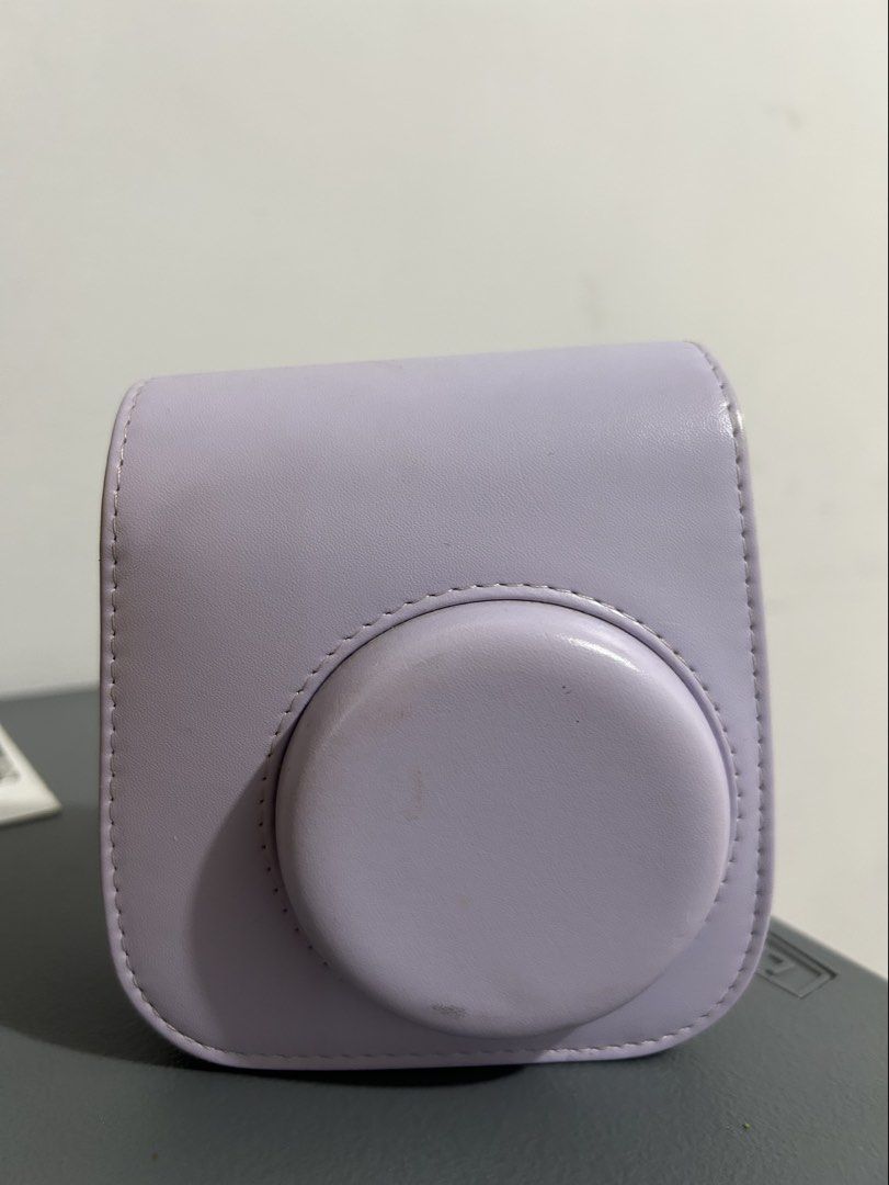 Fujifilm Instax Mini 11 (Category: Cameras) located in Quezon City. Submitted by kaoriru (Listing ID 1419496961, Image 2). Description: - color: lilac purple - with leather camera bag - with free extra films (heart sketch - 4 pcs inside instax; plain - 20 pcs expired but still usable) .