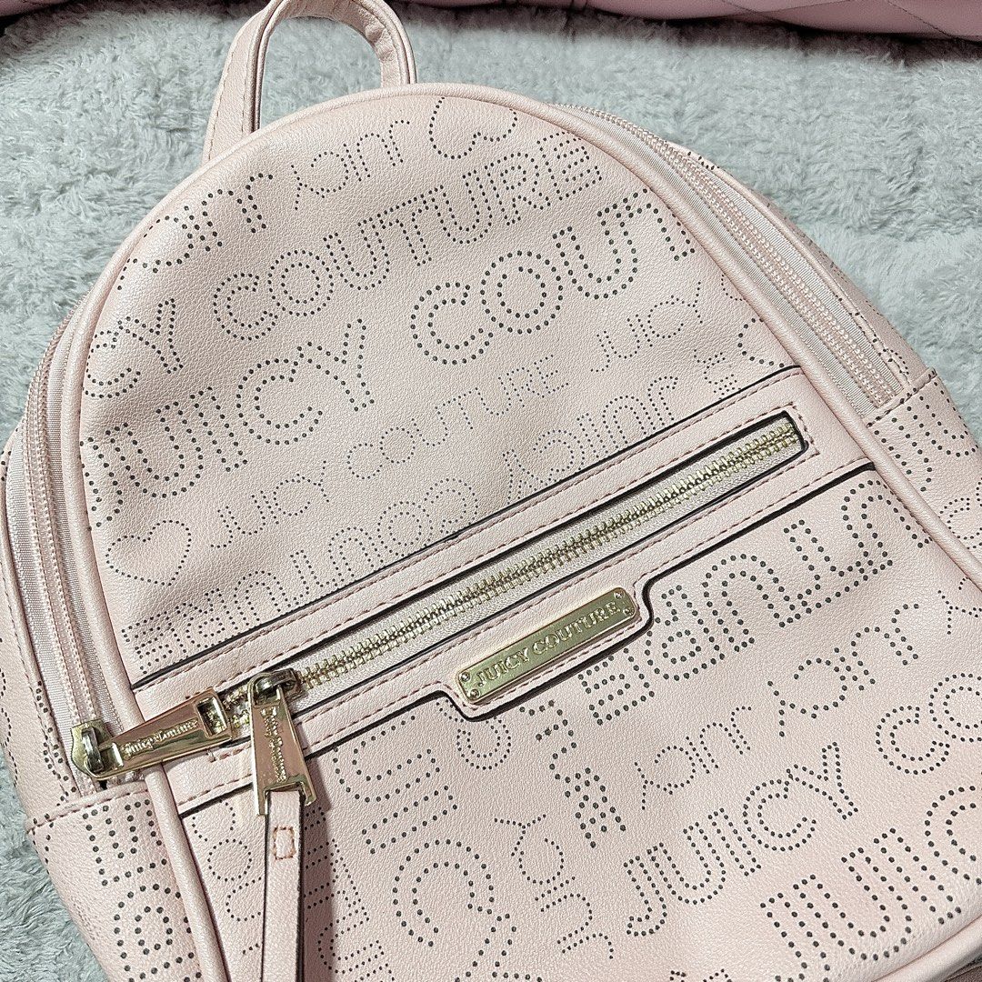 Juicy Couture Pink Backpack (Category: Backpacks) located in Paranaque City. Submitted by hershey_august (Listing ID 1422563135, Image 2). Description: - Juicy Couture pink backpack - Front zipper pocket - Main compartment with zipper closure - Brand name printed lining - Adjustable shoulder straps - Top handle.