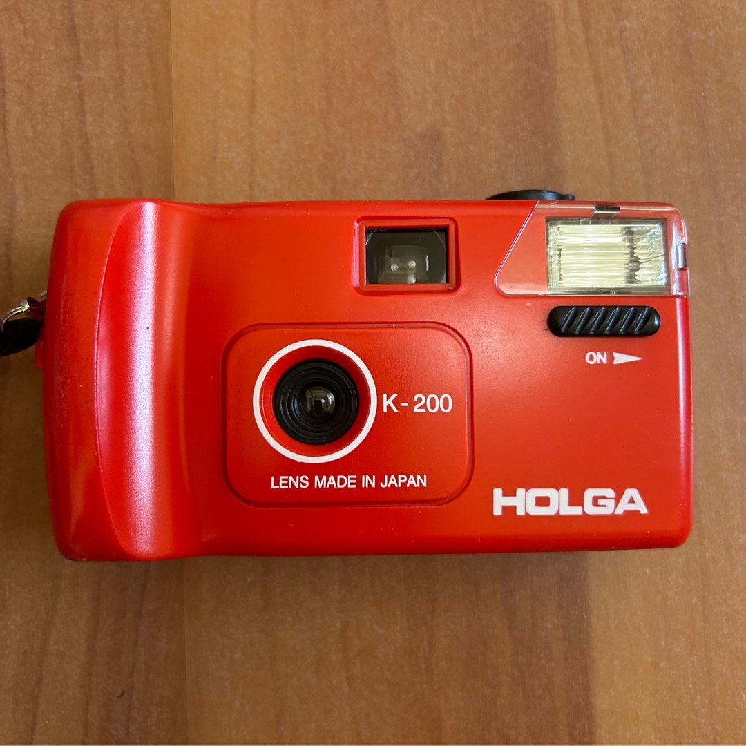 K-200 Holga film camera (Category: Cameras) located in Las Pinas. Submitted by pl4y_it_4g4in (Listing ID 1422618063, Image 1). Description: New Tested with battery and dummy film No issue With battery (1 AA), box, manual, pouch, and wrist strap.