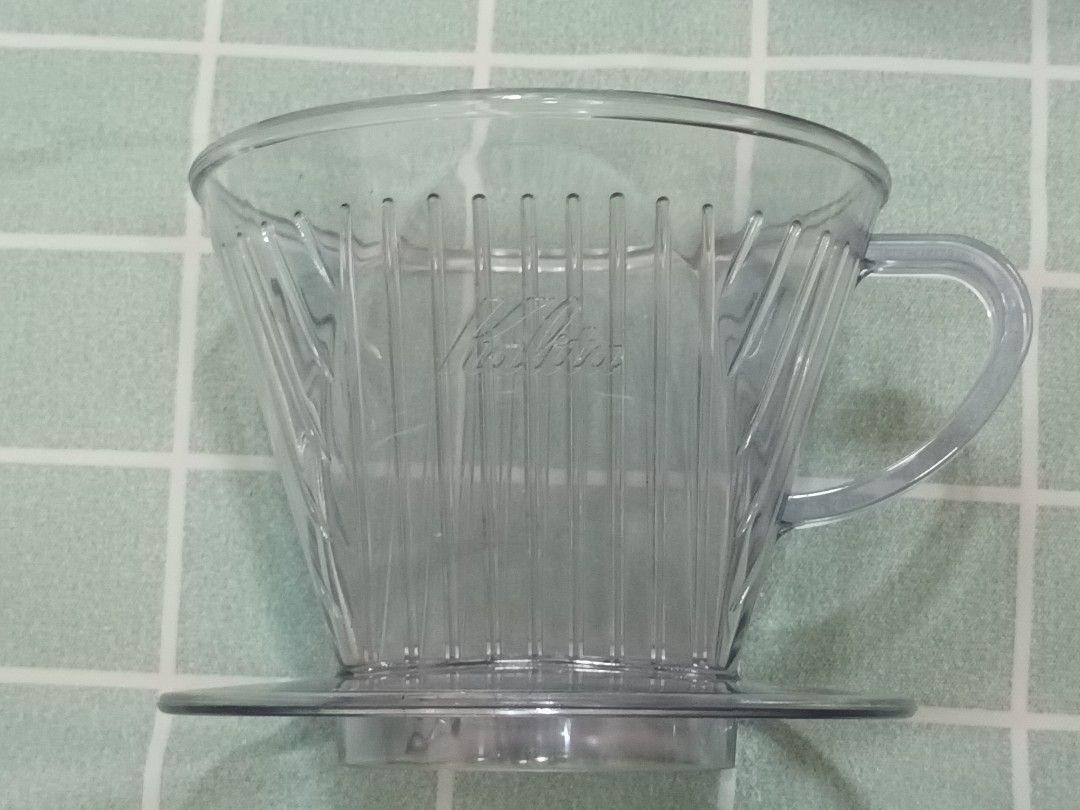 Kalita 102 Coffee Dripper (Category: Coffee & Tea Tableware) located in Calamba. Submitted by m_brian (Listing ID 1422655686, Image 1). Description: - Kalita 102 coffee dripper - Clear, cone-shaped design - Features vertical ridges, 3 holes - Designed for pour-over coffee brewing.