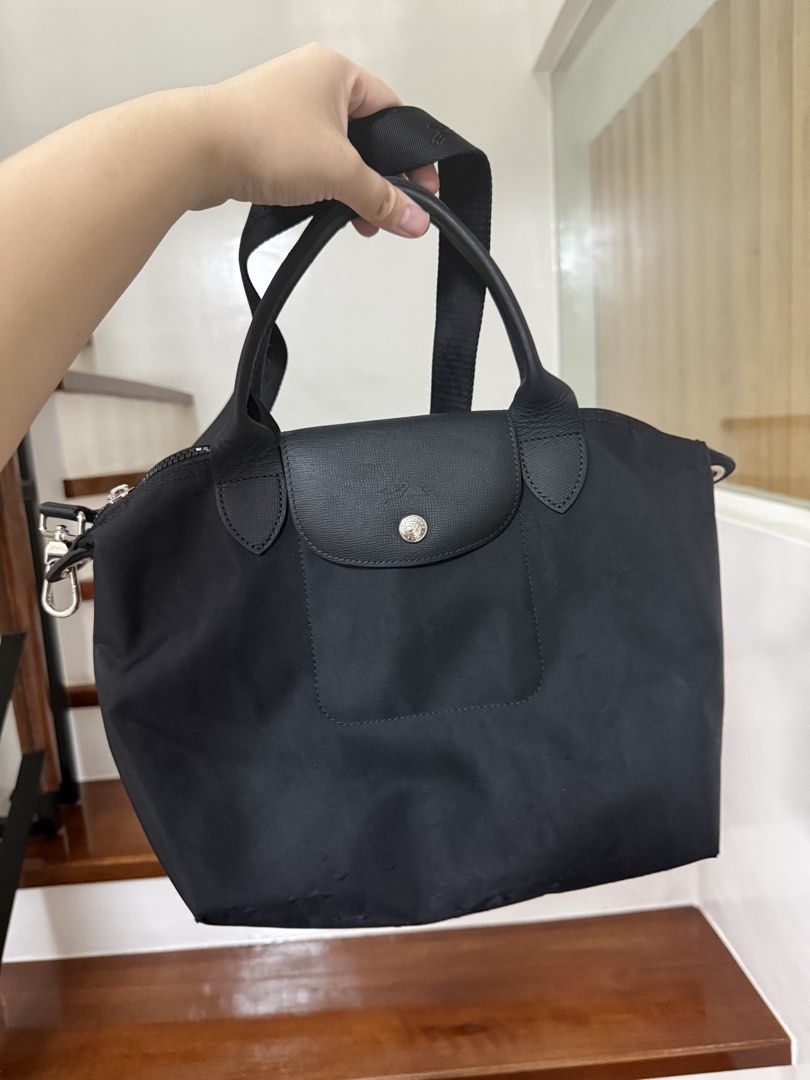 Longchamp Le Pliage with Strap (Category: Luxury Bags & Wallets) located in Cavite. Submitted by cha____r (Listing ID 1422627127, Image 1). Description: Authentic Longchamp Le Pliage Cuir handbag Black Used condition See photos for flaws.