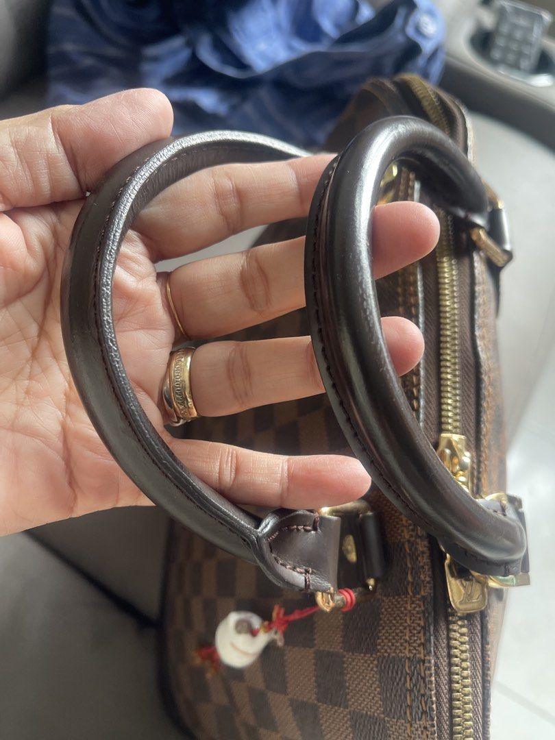 Louis Vuitton Alma Damier Ebene Handbag (Category: Luxury Bags & Wallets) located in San Juan City. Submitted by nhelsky_c (Listing ID 1422567694, Image 3). Description: - japan sourceLouis Vuitton Alma handbag - Damier Ebene canvas - Zip closure - Rolled leather handles - Spacious interior with slip pocket - Brown leather base and trim - Includes decorative charm - Dimensions: Approx. 9" height x 12" width.
