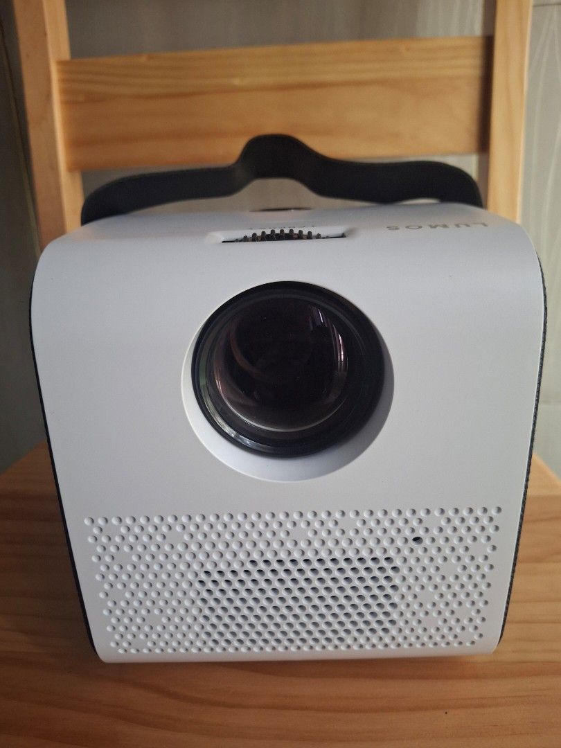Lumos Ray Projector (Category: Projectors) located in Pasay City. Submitted by jkmv0211 (Listing ID 1422554746, Image 2). Description: - Lumos Ray projector with multiple ports (HDMI, USB, AV). - Comes with remote control, power cable, and AV cable. - Features focus adjustment. - Built-in handle for easy portability. - Includes original box and user manual. Cash or Gcash Will give it for 8,000 if willing to meet up at Metropoint Mall Pasay..