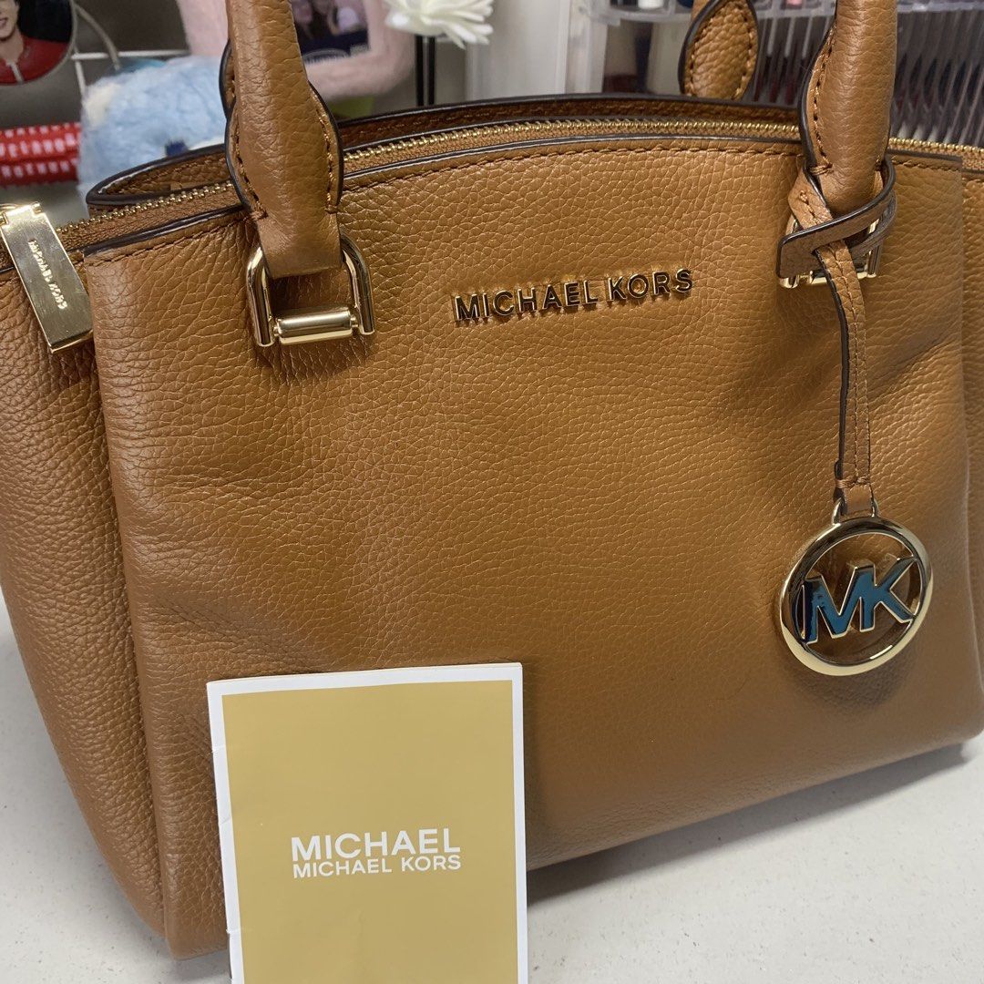 Michael Kors Maxine Small Messenger Hand Bag (Category: Luxury Bags & Wallets) located in Quezon City. Submitted by breadjinniecheeks (Listing ID 1422629271, Image 1). Description: - Authentic Michael Kors Messenger Hand Bag - Top handle design - Secure zip closure - Detachable MK charm - Interior with multiple compartments and zip pocket - Crafted from textured leather - Elegant gold-toned hardware - Includes care card, tag/iteketa inside. No du