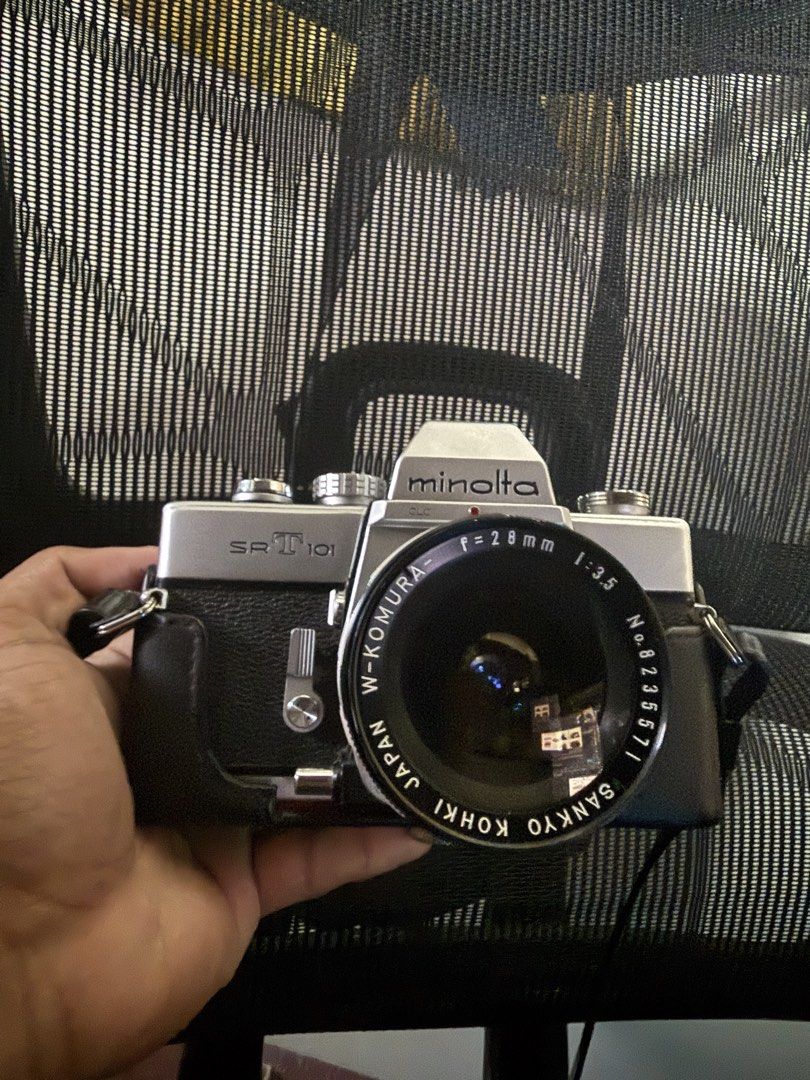 Minolta SRT 101 Film Camera (Category: Cameras) located in Malabon City. Submitted by gabbycart (Listing ID 1422625730, Image 1). Description: - No issues, used only 2x - Light meter working and still has battery Condition: Excellent working condition with some normal wear and tear. Includes: - Minolta MC Rokkor-PF 55mm f/1.7 lens - Sankyo Kohki W-Komura 28mm f/3.5 lens - Original Minolta case and lanyard - Extra lens caps.