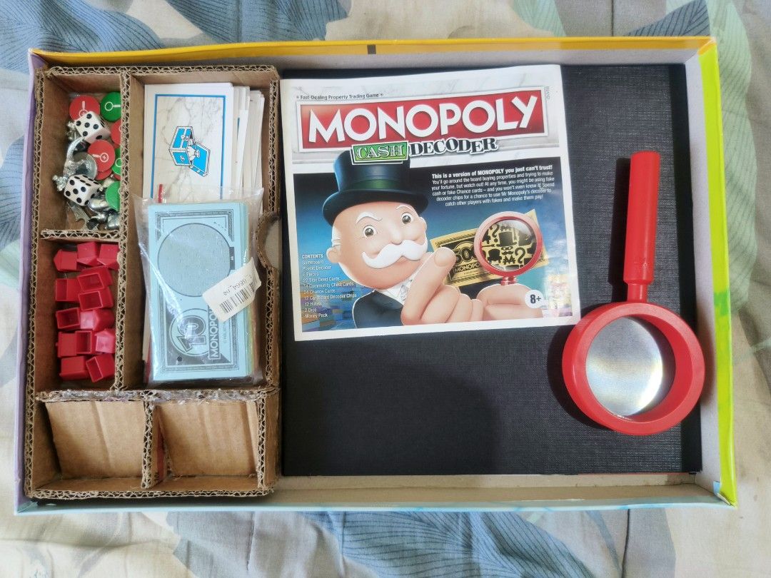 Monopoly Cash Decoder Board game (Category: Board Games & Puzzles) located in Consolacion. Submitted by mkb187 (Listing ID 1422581452, Image 2). Description: Monopoly Cash Decoder Selling for only 1500php 100% Complete includes a DIY cardboard compartment for storage played less than 10 times minor dents and scratches MOP: Gcash ‎delivery: J&T ‎ ‎If meet up. I'm only available through 3-7 P. M. (Weekdays) and ‎10A. M. --- 7P. M. (Weekends) ‎ ‎if 