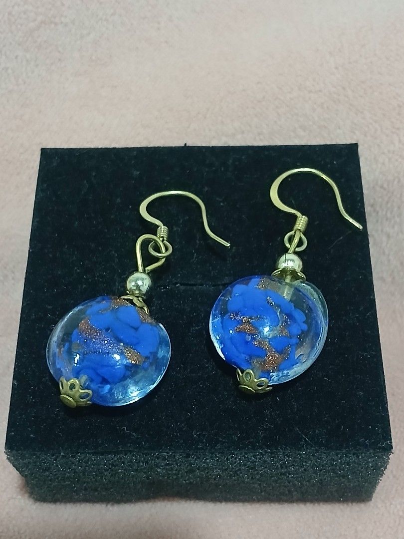 Murano Glass Blue & Gold Foil Dangle Earrings (Category: Earrings) located in Sariaya. Submitted by cuatrocats (Listing ID 1422684849, Image 2). Description: - Beautifully handcrafted Murano glass earrings - Features a vibrant cobalt blue base infused with shimmering copper/gold aventurine flecks - Elegant drop style with gold-tone French hooks.