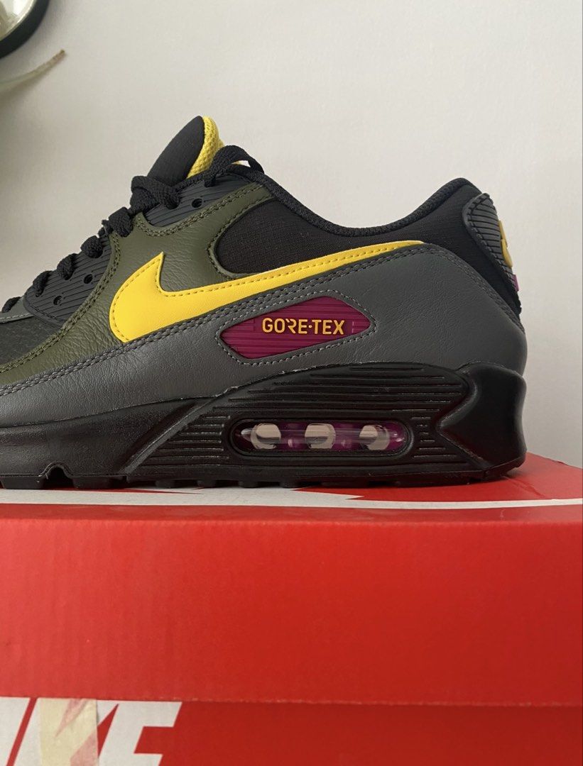 Nike Air Max 90 Gore-Tex Sneakers (Category: Sneakers) located in Caloocan City. Submitted by zephir1n (Listing ID 1422574159, Image 3). Description: - Nike Air Max 90 Gore-Tex sneakers - Colorway: Black, Grey, Yellow - Gore-Tex technology for weather protection - Pink accent on the sole - Black sole - Yellow Nike swoosh - Includes original Nike box.