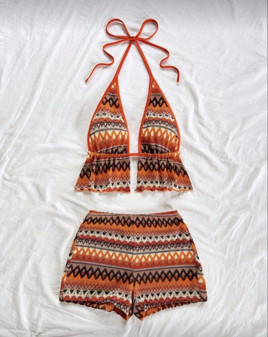 Orange Knit Halter Top and Shorts Set (Category: Sets or Coordinates) located in Manila. Submitted by ms.leiaaa (Listing ID 1422693891, Image 1). Description: - Two-piece set: halter top and shorts - Halter top with neck tie - Shorts with elastic waistband - Made of comfortable knit material - Eye-catching orange color with geometric pattern - Ideal for casual summer wear.