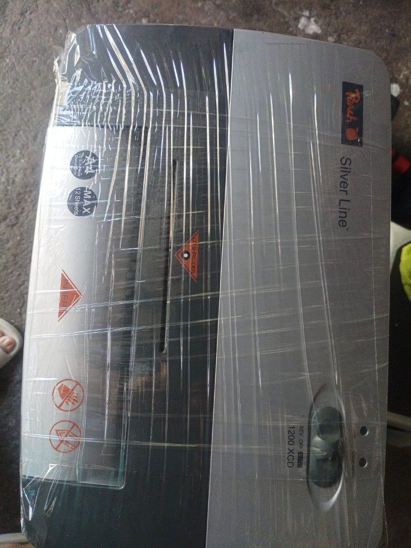 Peach Silver Line 1200XCD document shredder (Category: Office & Business Technology) located in Las Pinas. Submitted by jaziyah4 (Listing ID 1422550181, Image 3). Description: This office-ready document shredder can shred not only documents but also CDs. With its elegant silver head and dark gray body, the Peach 1200XCD blends seamlessly into any interior. One of the world's best-selling models, the Peach 1200XCD boasts exceptional reliability, r