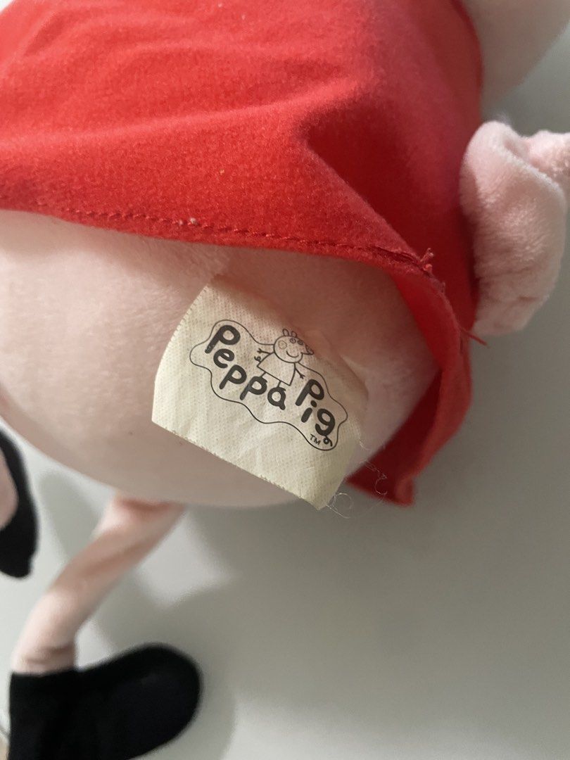 Peppa Pig Plush Toy (Category: Plushies & Soft Toys) located in Taguig. Submitted by declutteringmom314 (Listing ID 1422711194, Image 3). Description: - original - mall bought Peppa Pig plush toy - Features Peppa in a red dress.