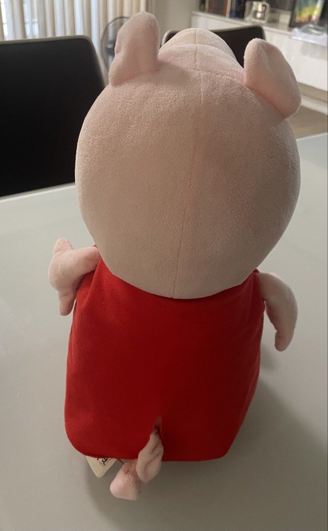 Peppa Pig Plush Toy (Category: Plushies & Soft Toys) located in Taguig. Submitted by declutteringmom314 (Listing ID 1422711194, Image 2). Description: - original - mall bought Peppa Pig plush toy - Features Peppa in a red dress.
